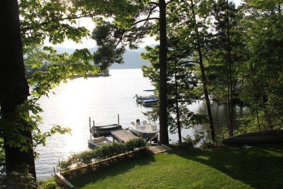 View of private dock and lawn from front porch