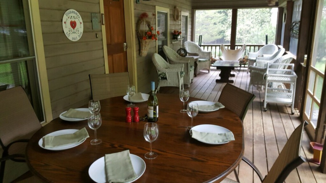 Screened porch - dine and talk in to the night.
