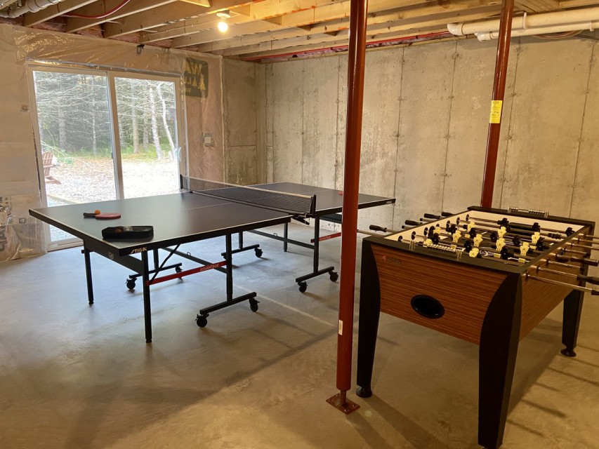Game room with access to fire pit.