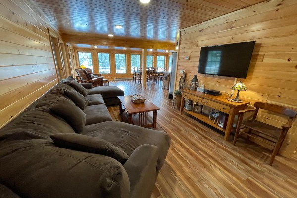 living area with views of Moose River with Smart TV