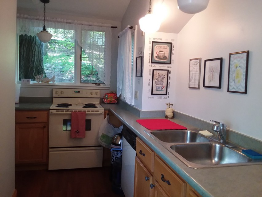 Kitchen with dishwasher, stove, fridge