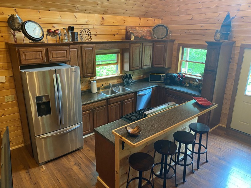 Fully stocked kitchen with stainless appliances