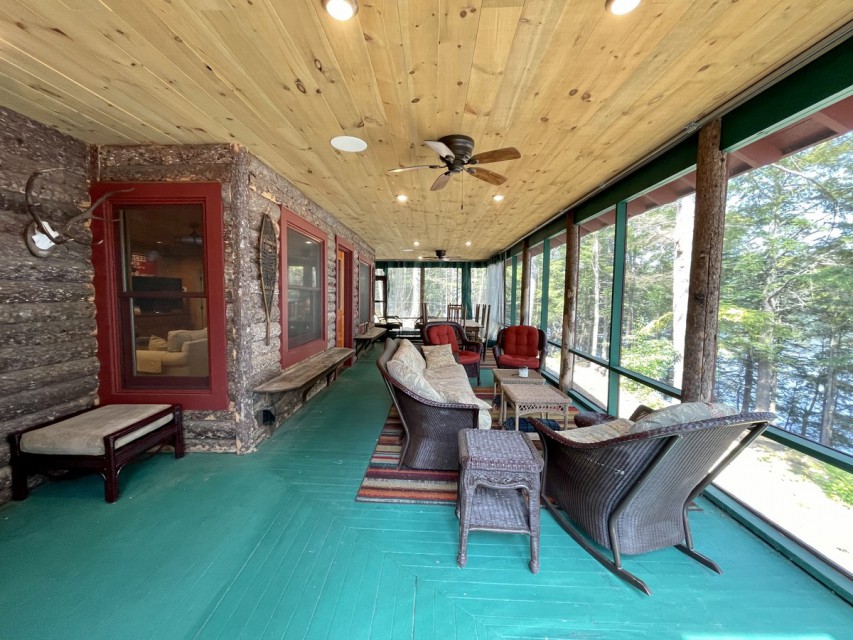 Screened in porch with dining and sitting area