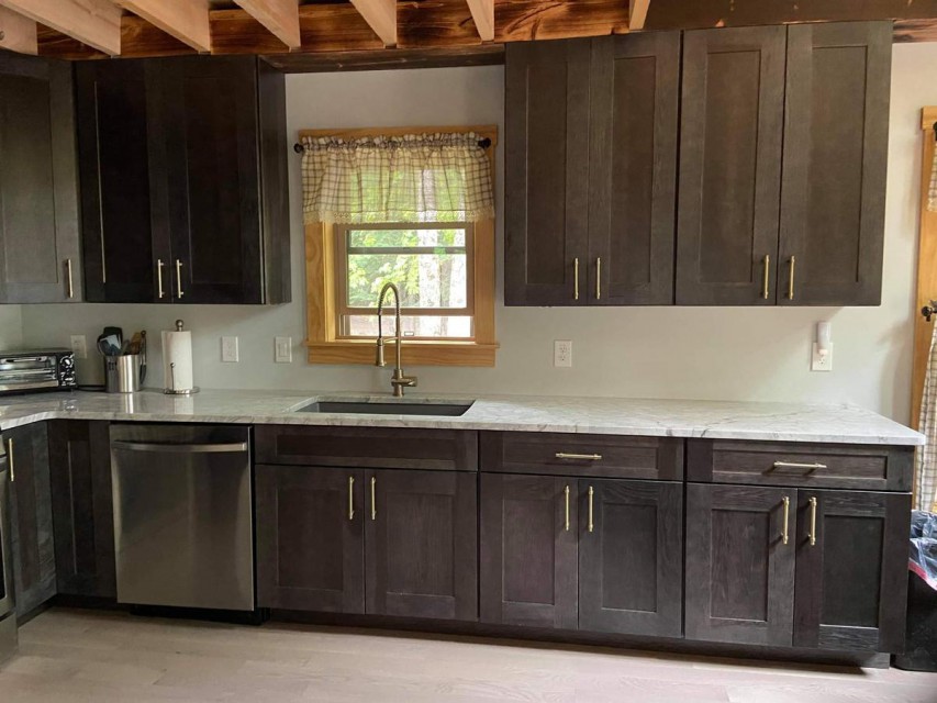 Charcoal hickory cabinets and quartzite counters 