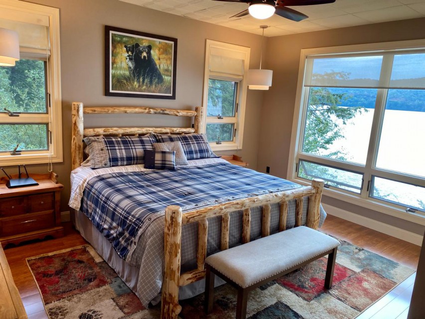 Master bedroom with king bed and spectacular lake views