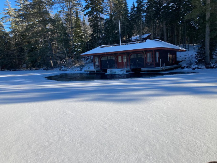 front of boathouse from frozen lake