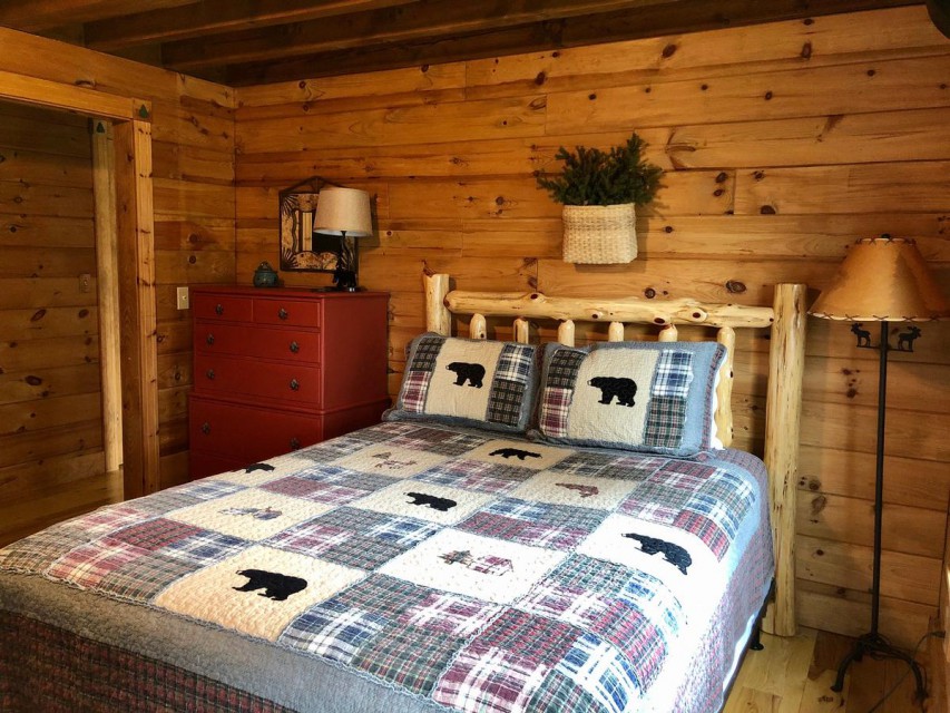 Bedroom with full bunk beds and additional queen bed