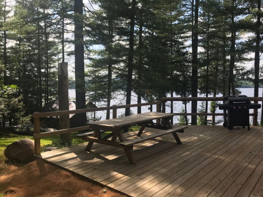 XL deck and picnic table overlooking lake & lean-to 