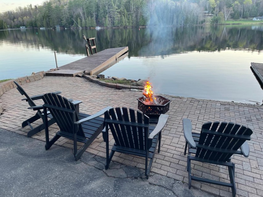 fire pit and seating area at waterfront