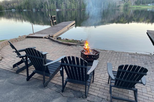 fire pit and seating area at waterfront