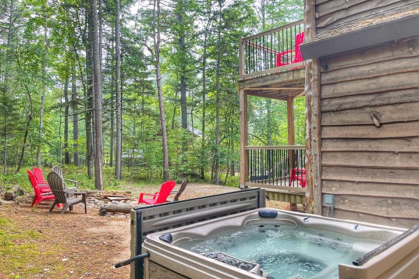 Luxurious hot tub, fire pit with plenty of seating.