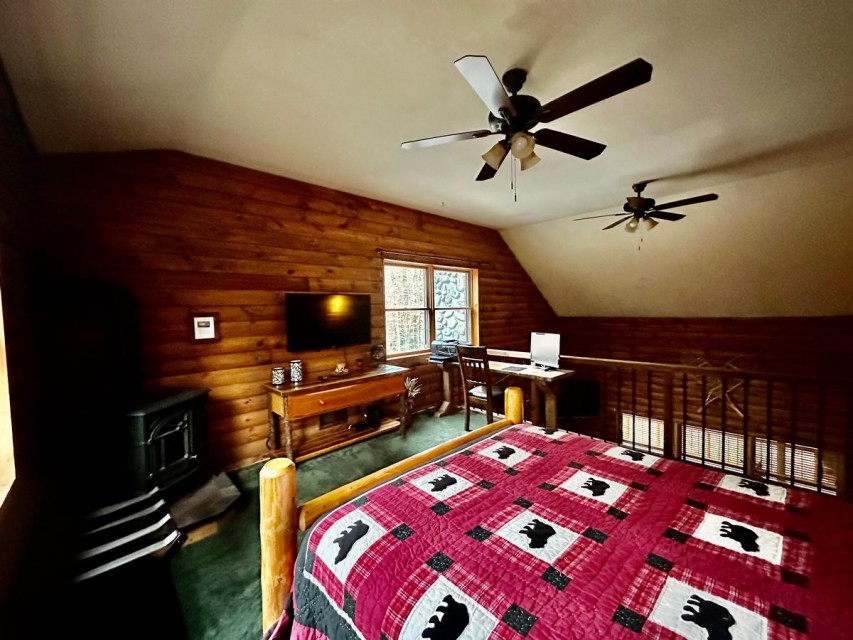 Loft bedroom w/ log style full bed and work space