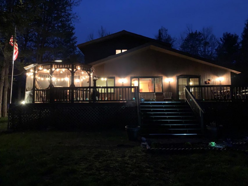 View from dock of cabin at night.