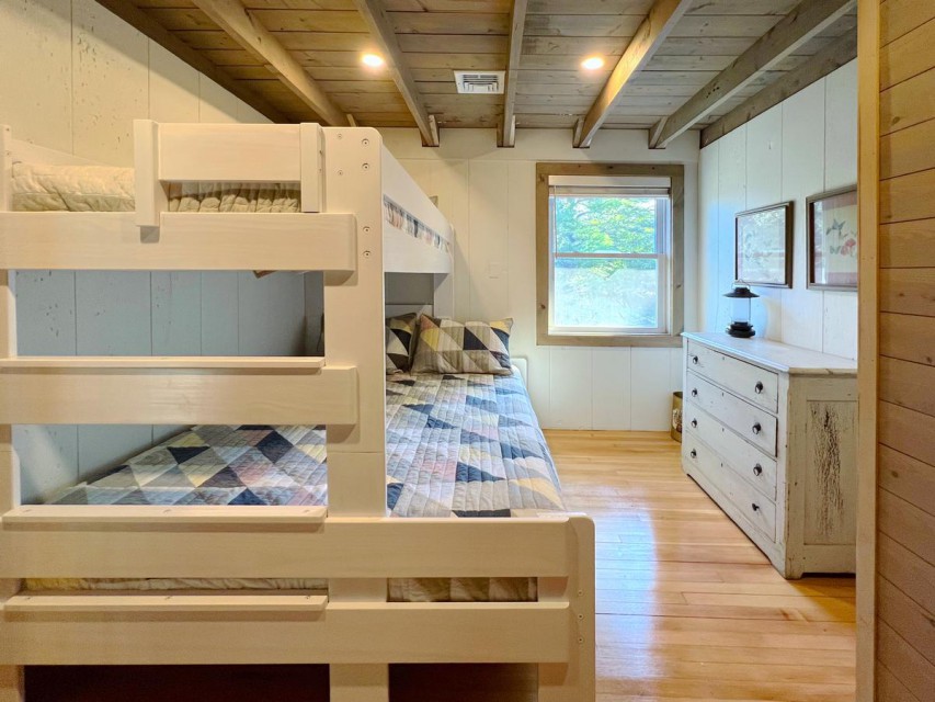 Upstairs bedroom with queen and twin bunk.