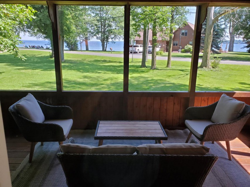 Screened in porch with lake view