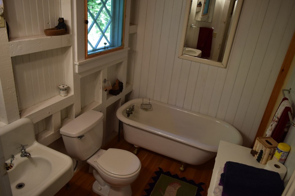 3rd bathroom with antique clawfoot bathtub 