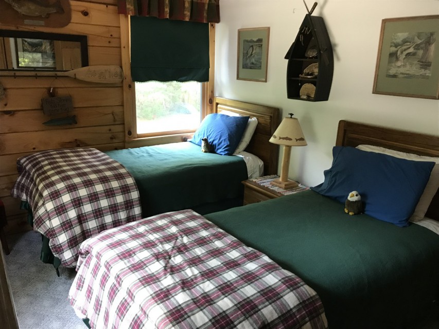 Third bedroom, with twin beds, fishing theme.
