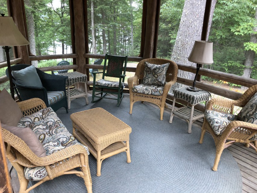 Screened gazebo off deck with view to lake. 