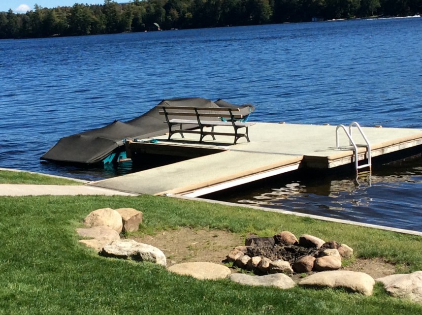Private dock with swimming ladder and firepit