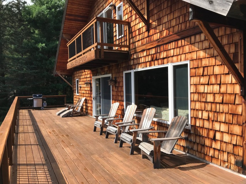 The spacious deck and balcony above.