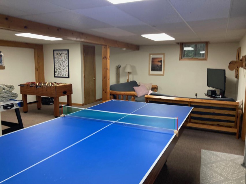 Game room with ping pong, pool table, foosball, TV
