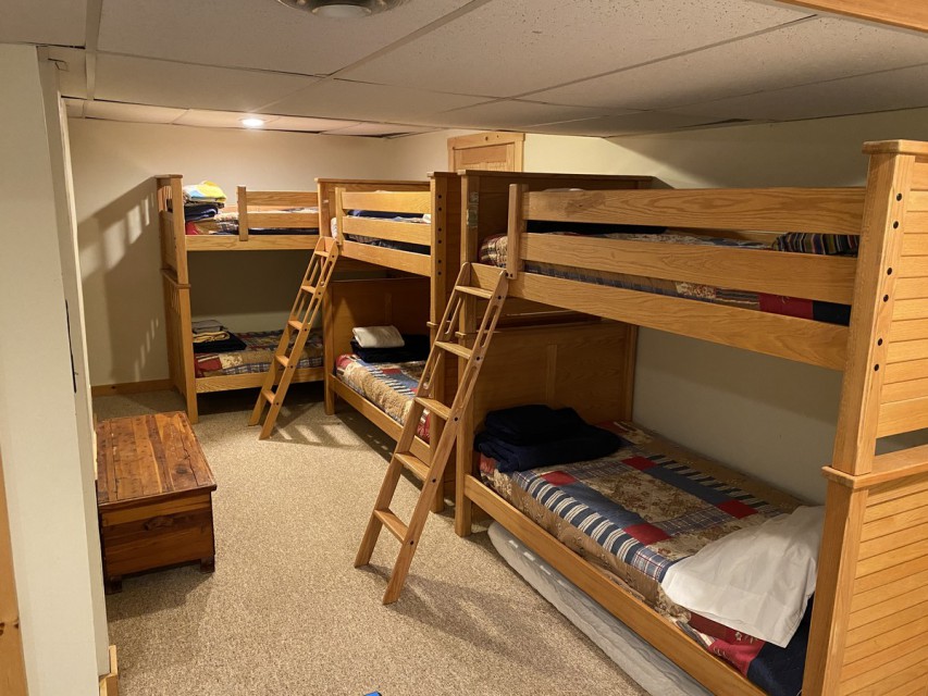 Three sets of bunkbeds in finished, walk-out basement