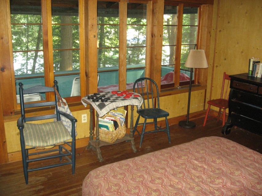 Smaller cottage main room with sleeping porch and lake