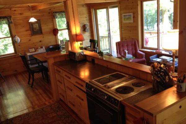 Full size open galley kitchen with lake views