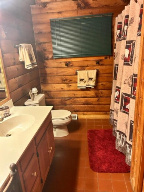 Main floor bathroom with full tub and shower