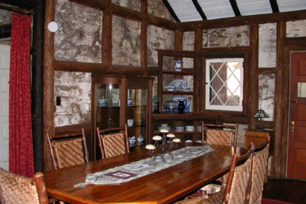 Dining room with large fireplace. Original antiques.