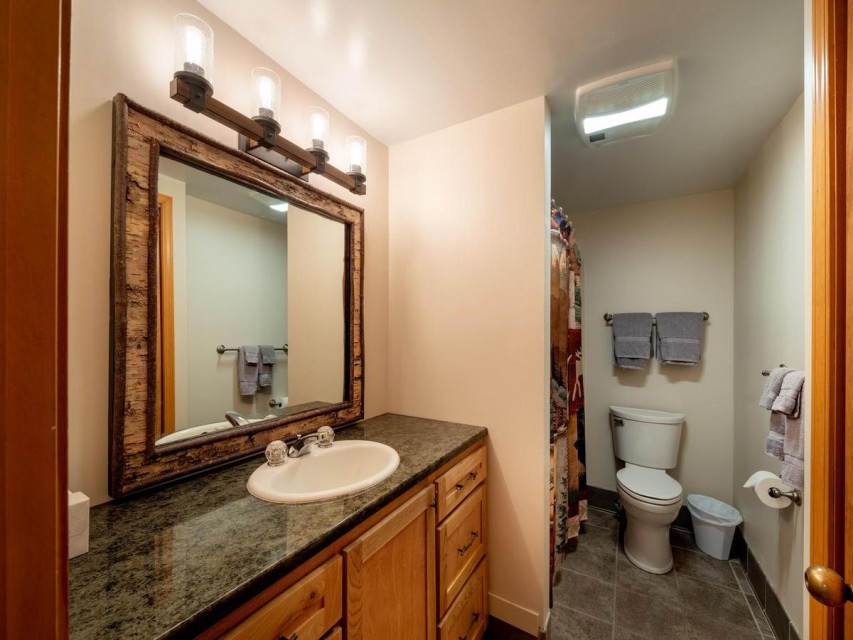 One of our two full bathrooms, with granite counters...