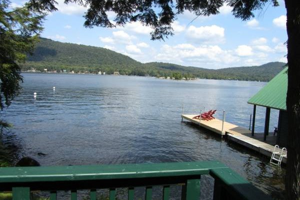 View of dock, swimming area & boathouse from front deck