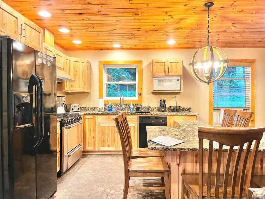 Beautiful kitchen & granite table top has seating for 8