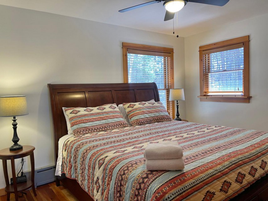 Bedroom 2 has king bed, smart TV, closet & ceiling fan.