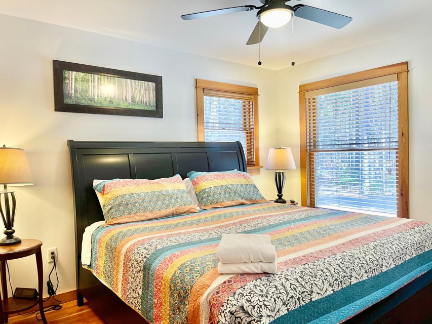 Bedroom 3 has king bed, smart TV, closet & ceiling fan.