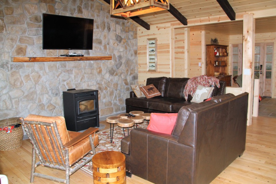 Upstairs family room with pellet stove and satellite tv
