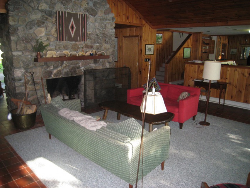 Living room with classic Adirondack stone fireplace