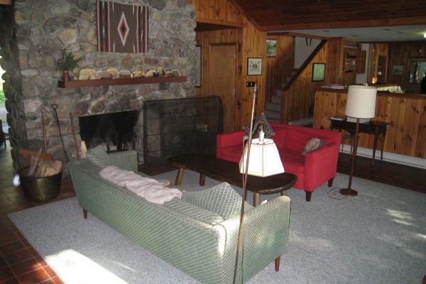 Living room with classic Adirondack stone fireplace