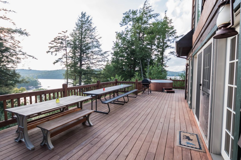 Deck with hot tub, charcoal grill, seating for 24