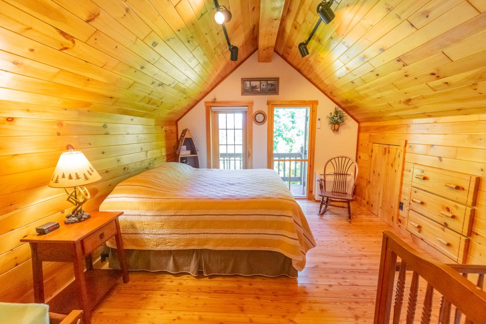 King Bedroom with crib and deck with lake view, 2nd flo