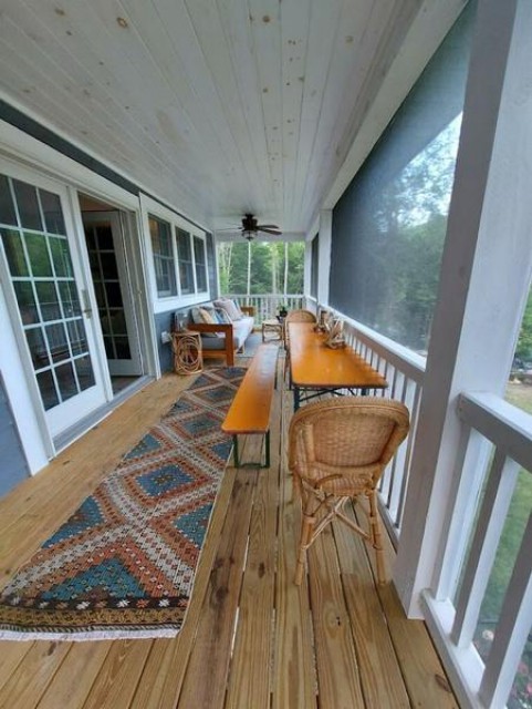 The screened in porch is large with plenty of seating