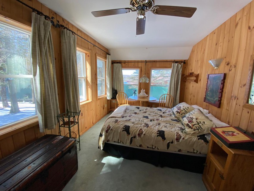 Main house bedroom with queen size bed