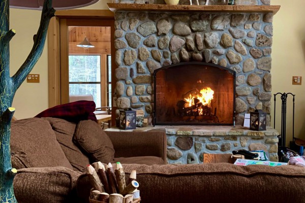 family room with stone fireplace  