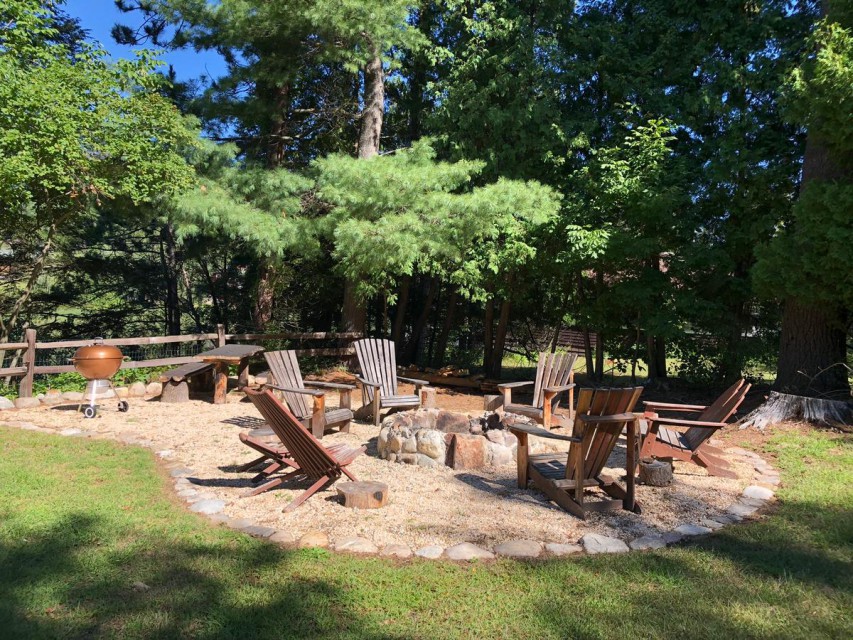 Side yard w/ fire pit, ADK chairs, and picnic table