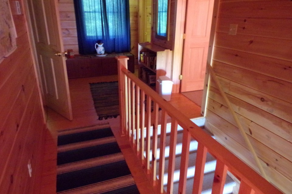 upstairs landing w left door to bedroom, right to bath