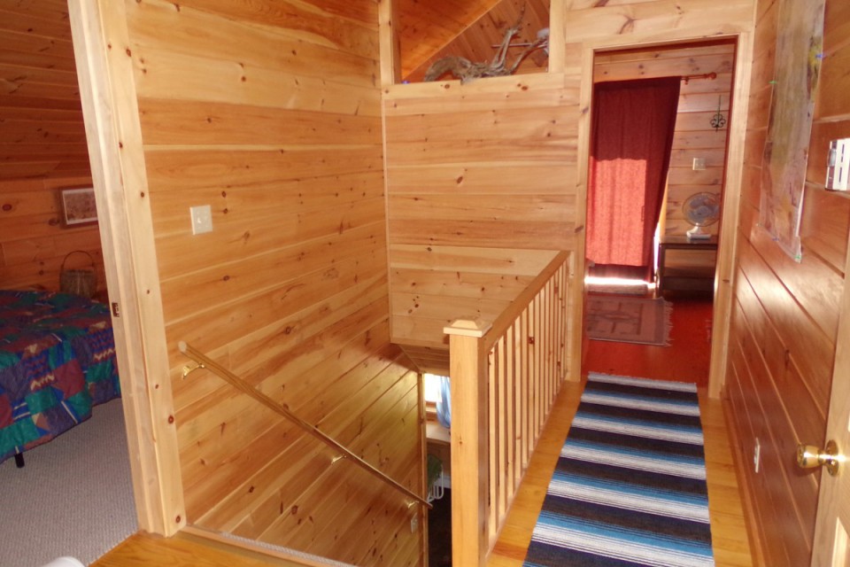 view from upstairs landing to front of cabin